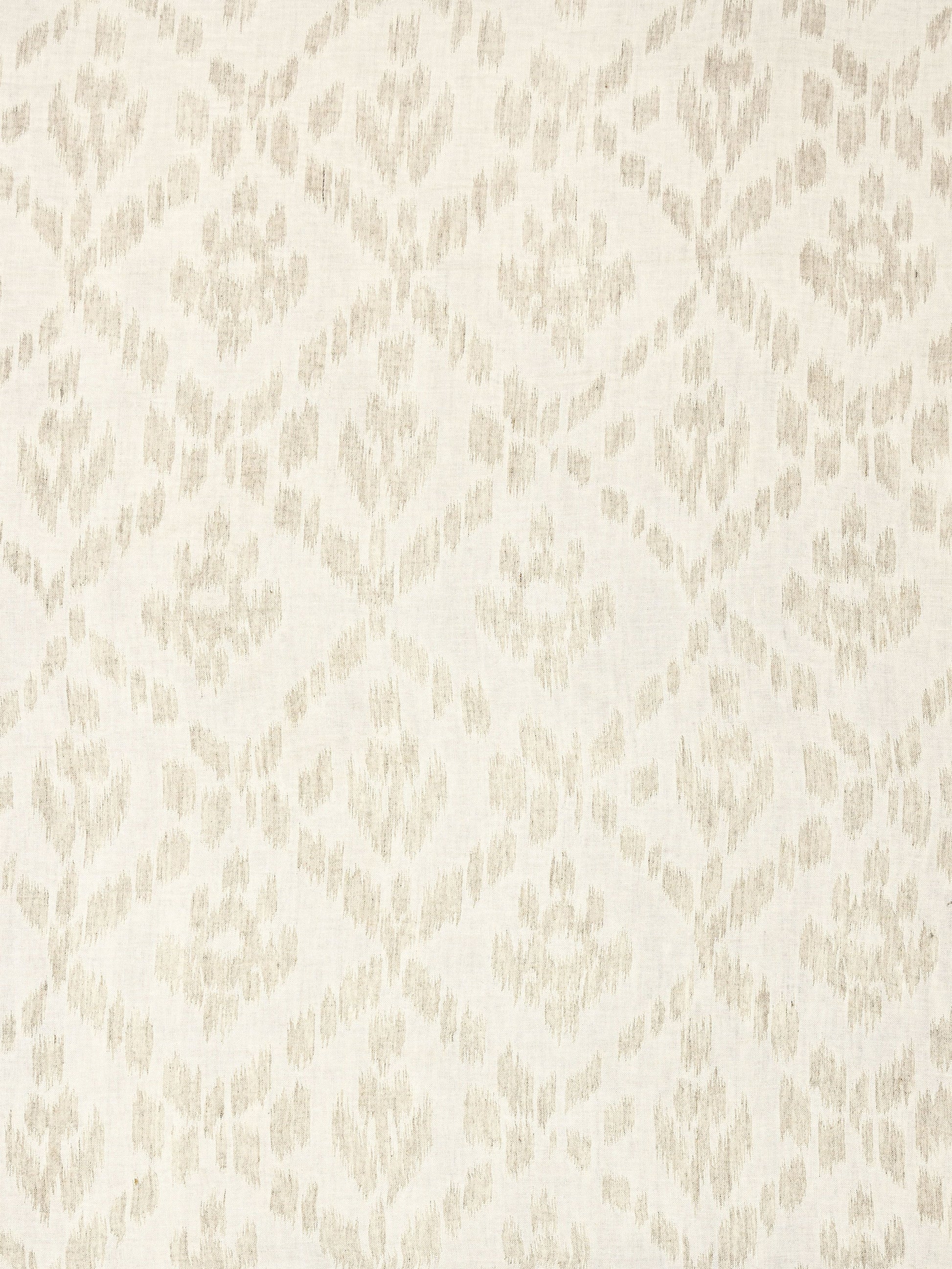 Ivory fabric with a soft beige ikat-inspired diamond damask pattern.