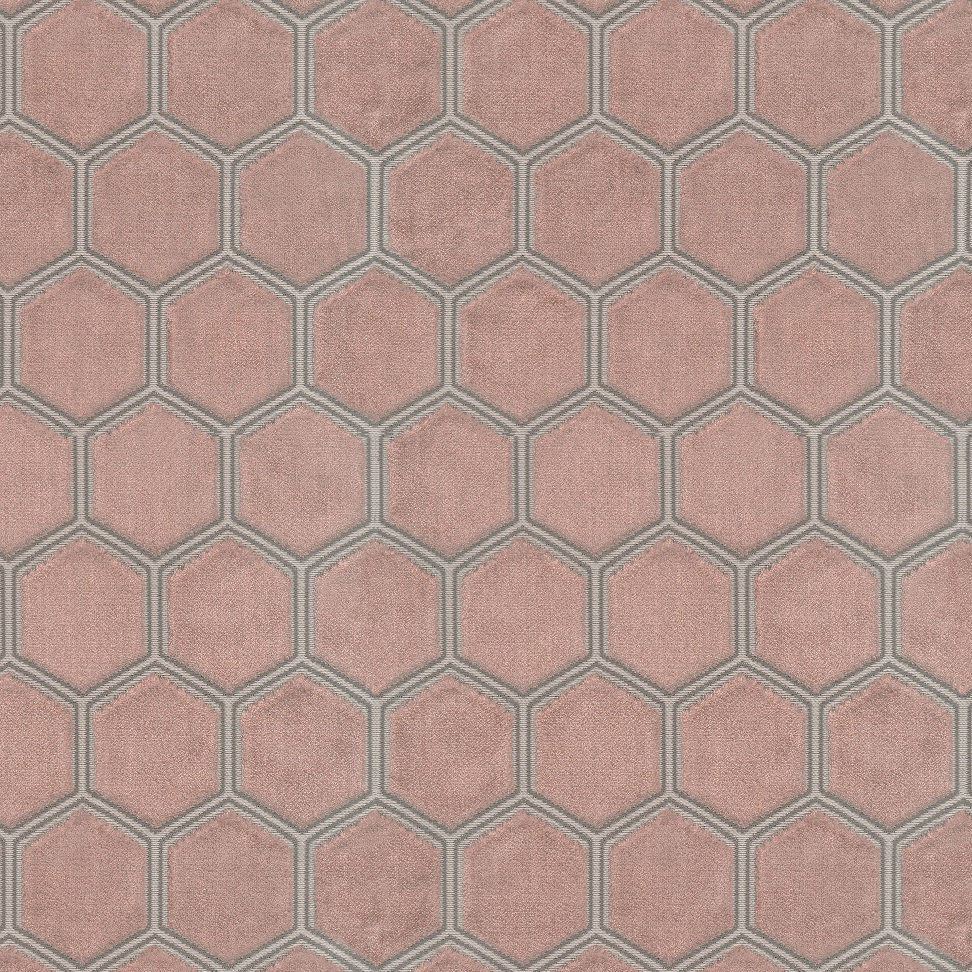 Pink velvet fabric with a hexagonal honeycomb geometric pattern.