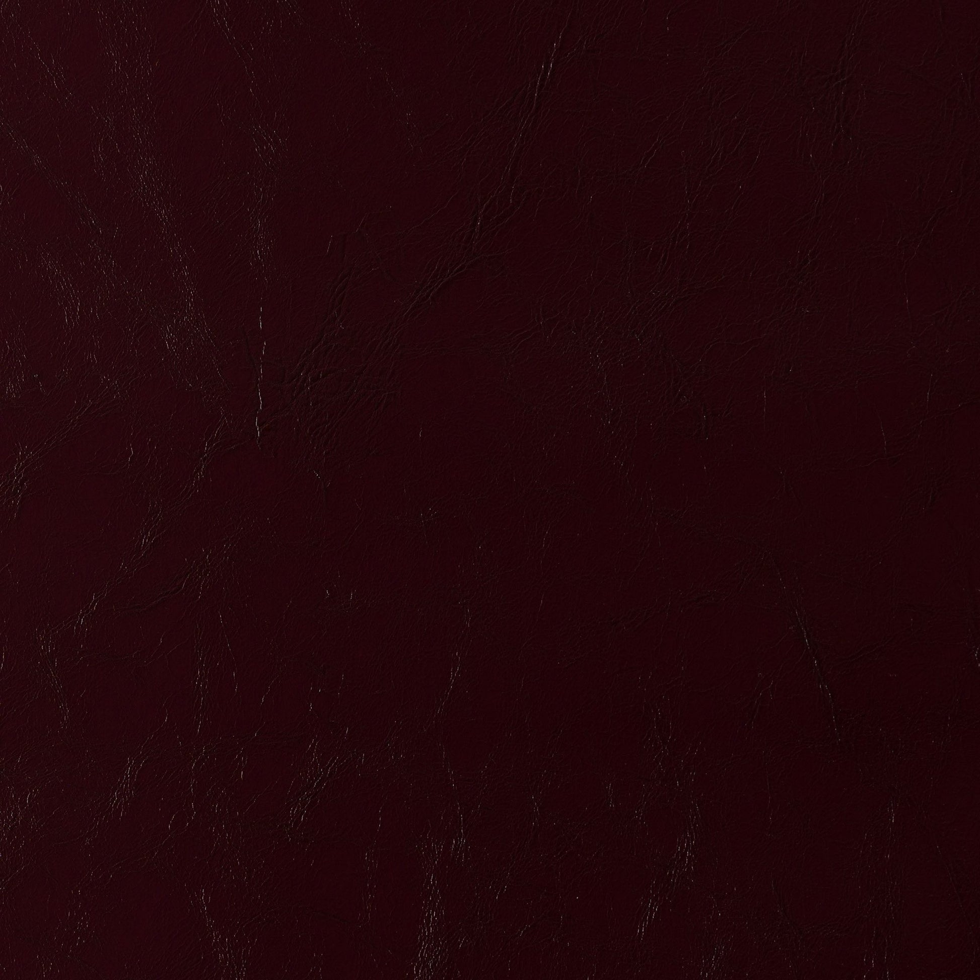 Dark burgundy faux leather texture with pronounced grain on vinyl fabric; rich maroon finish.
