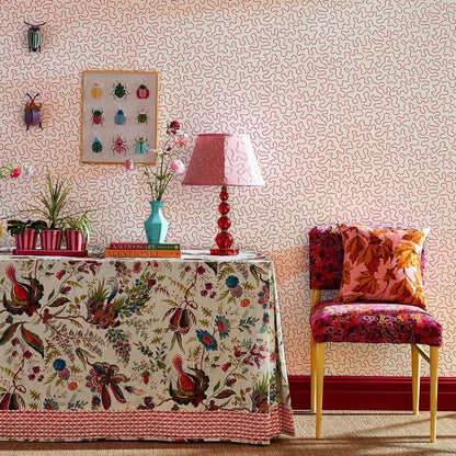 Wiggle Wallpaper in Carnelian and Rose Quartz by Harlequin x Sophie Robinson featuring a flowing abstract line pattern inspired by butterfly flight paths in a country garden. Luxury designer wallpaper with warm pink, coral, and rose tones, ideal for statement walls, colorful interiors, modern English country homes, living rooms, bedrooms, powder rooms, nurseries, home offices, and contemporary interior design projects.