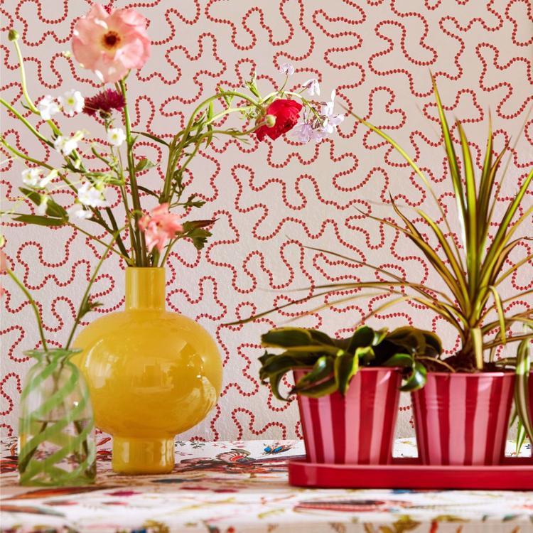 Wiggle Wallpaper in Carnelian and Rose Quartz by Harlequin x Sophie Robinson featuring a flowing abstract line pattern inspired by butterfly flight paths in a country garden. Luxury designer wallpaper with warm pink, coral, and rose tones, ideal for statement walls, colorful interiors, modern English country homes, living rooms, bedrooms, powder rooms, nurseries, home offices, and contemporary interior design projects.