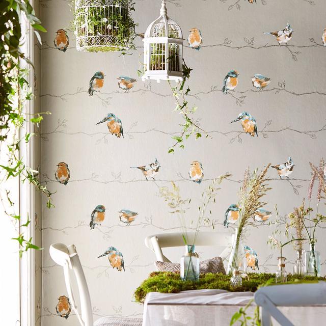Luxury Harlequin Persico Coral Lemon wallpaper featuring elegant birds and botanical branches in coral and yellow tones, ideal for statement walls and upscale interior design.