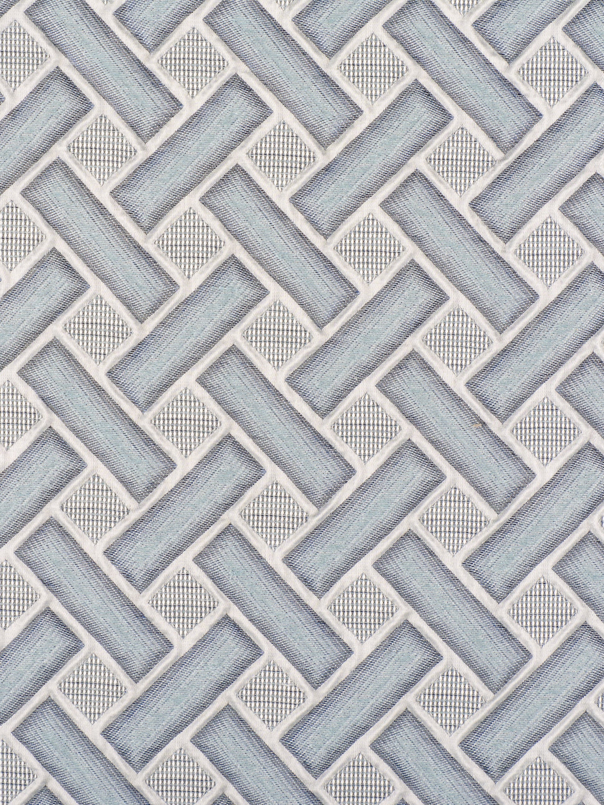 Blue-gray woven basket-weave tile pattern with white grout, wall backsplash style.