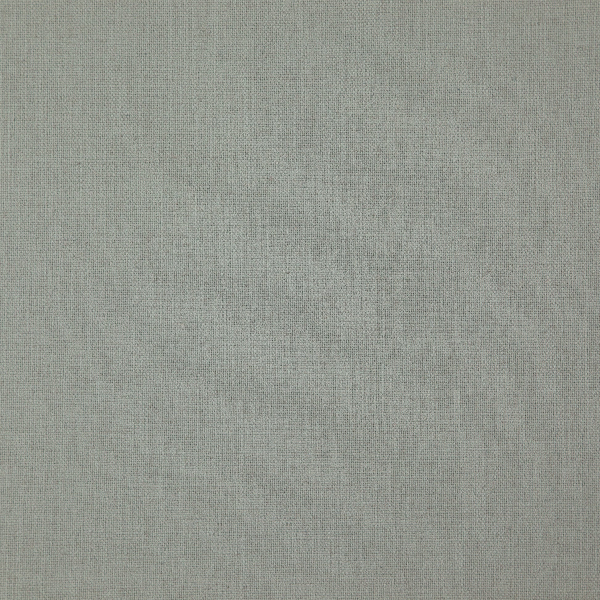 Close-up of light olive-gray linen fabric texture with visible weave.
