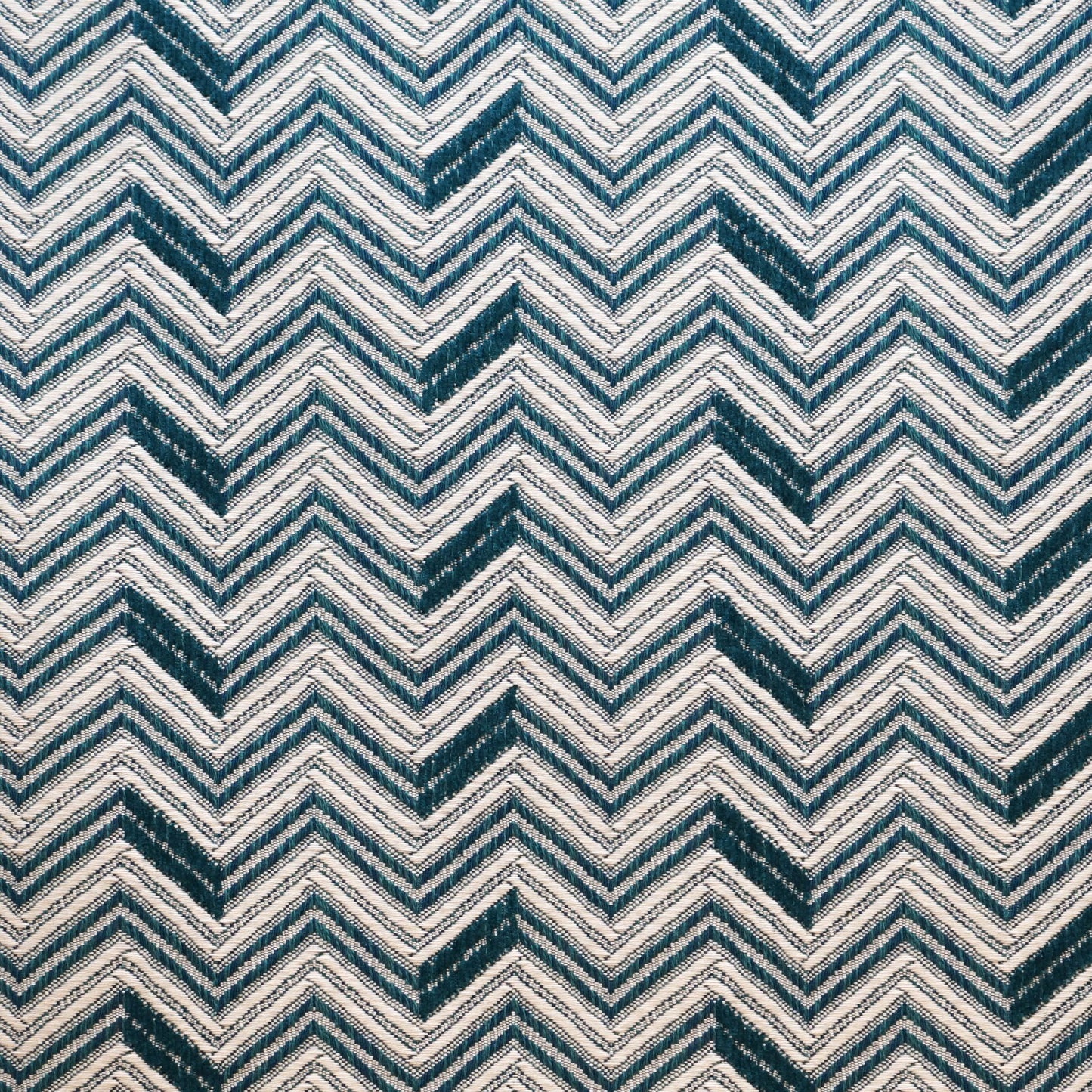 Teal and navy chevron zigzag pattern on textured Jacquard fabric.