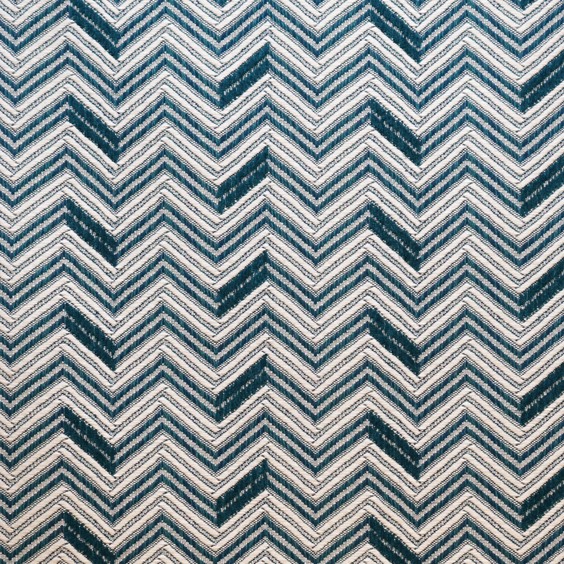 Teal and navy chevron zigzag pattern on textured Jacquard fabric.