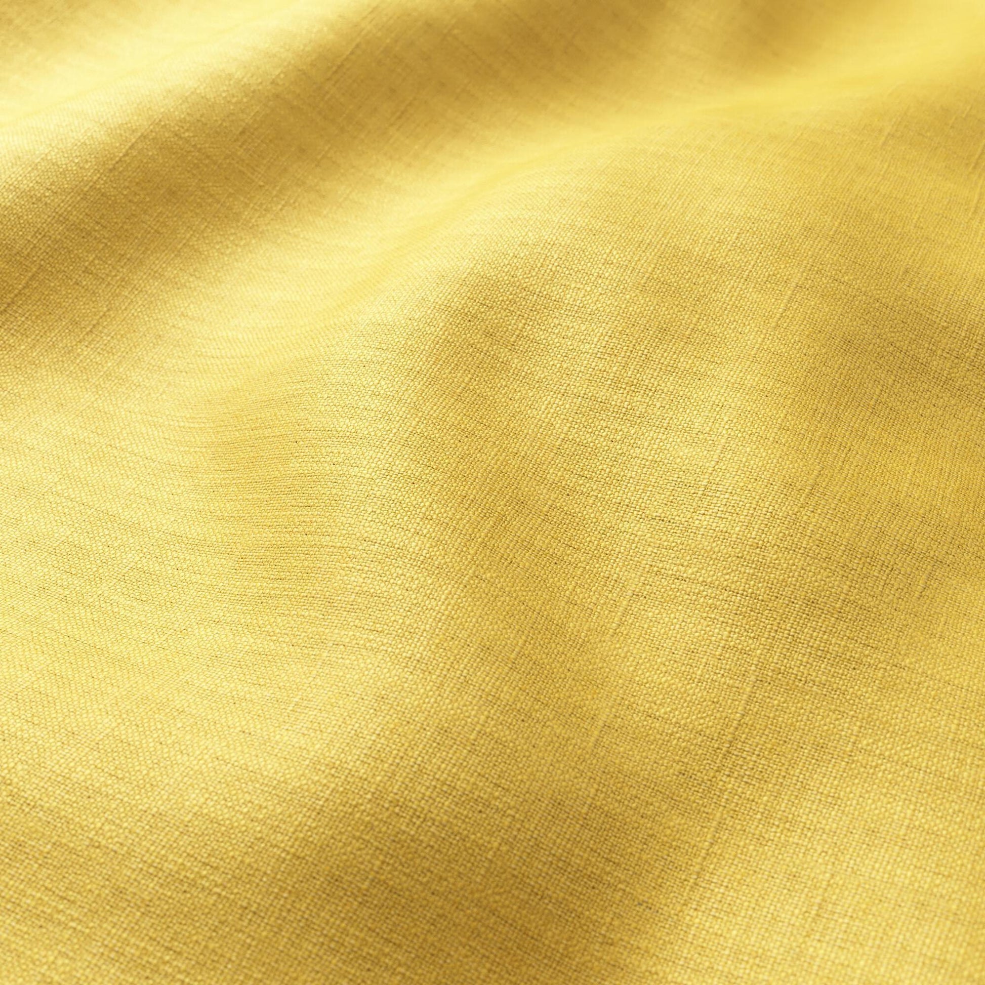 Bright yellow linen-like fabric with soft drape and subtle weave texture.