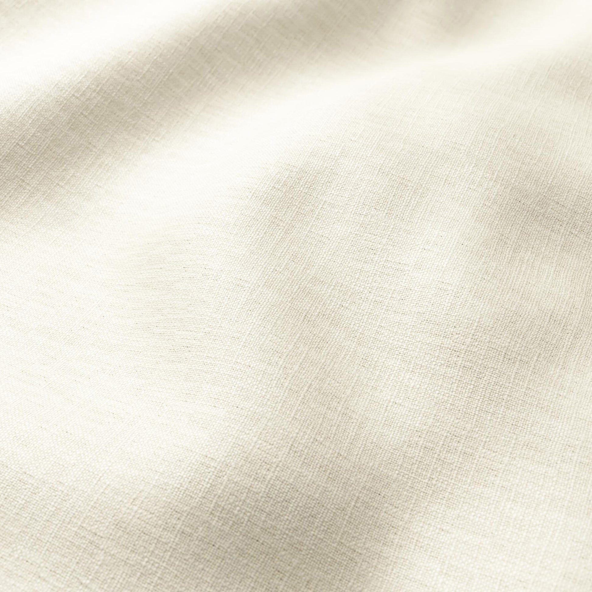 Cream linen-textured fabric with soft drape and visible weave.
