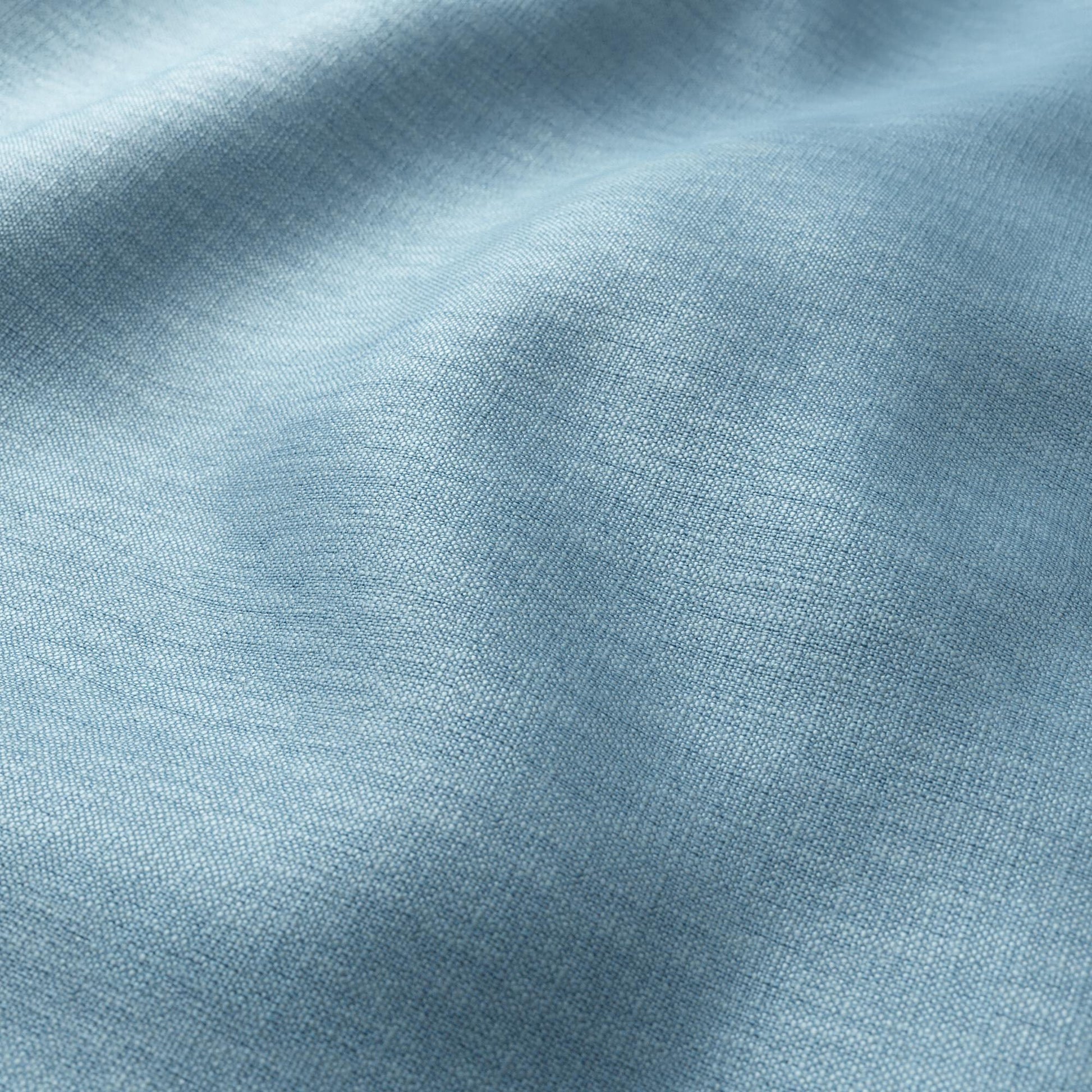 Light blue woven fabric with a soft texture and gentle folds.