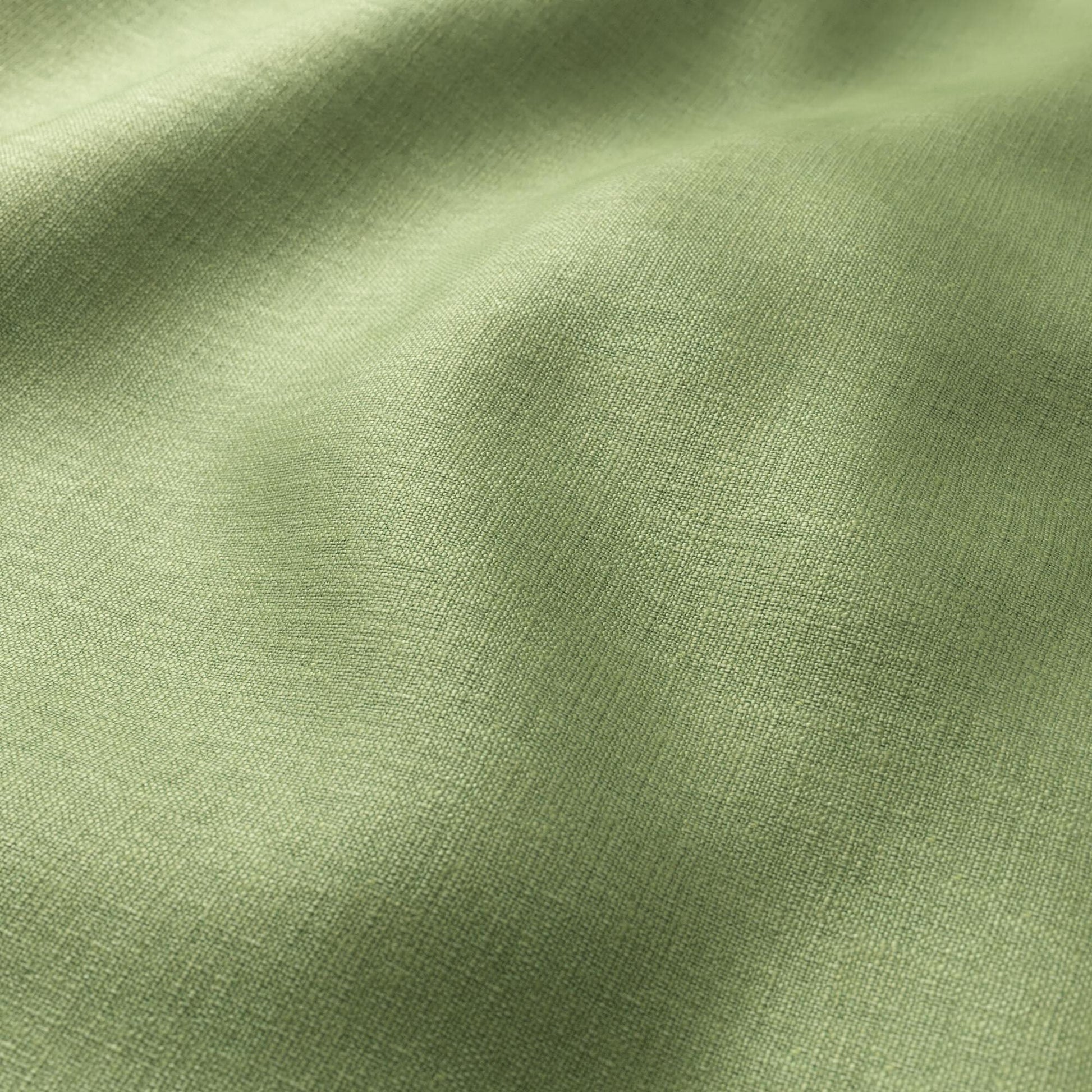 Olive green linen-textured woven fabric close-up with soft folds.