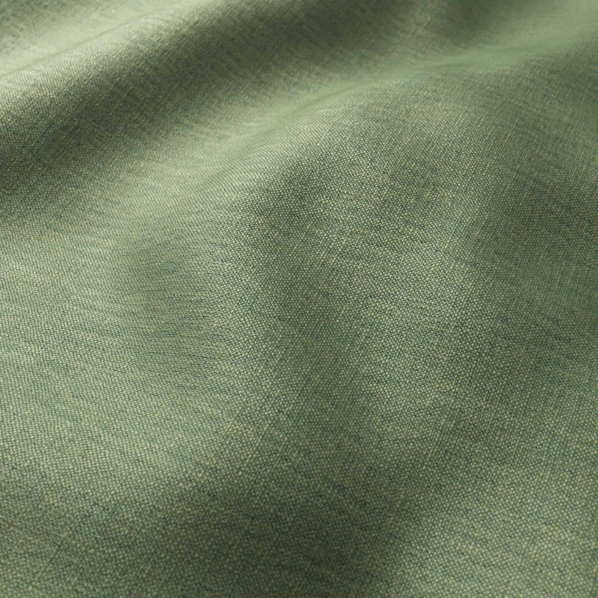 Olive green linen-like fabric close-up with soft folds and fine woven texture.