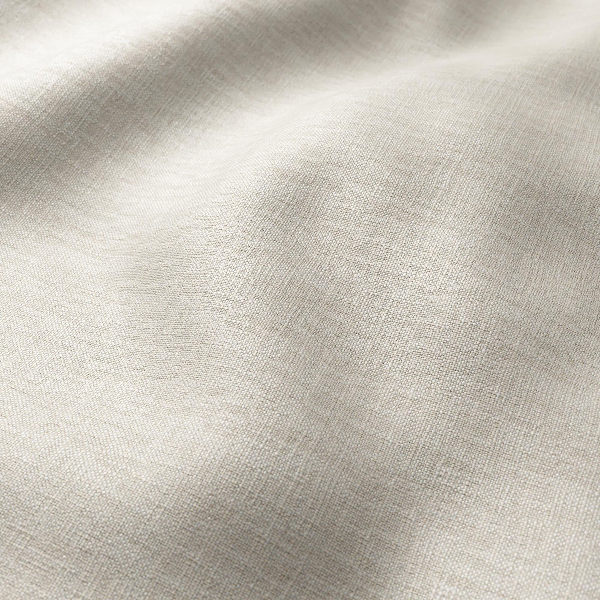 Grey woven fabric close-up with textured weave and soft drape.