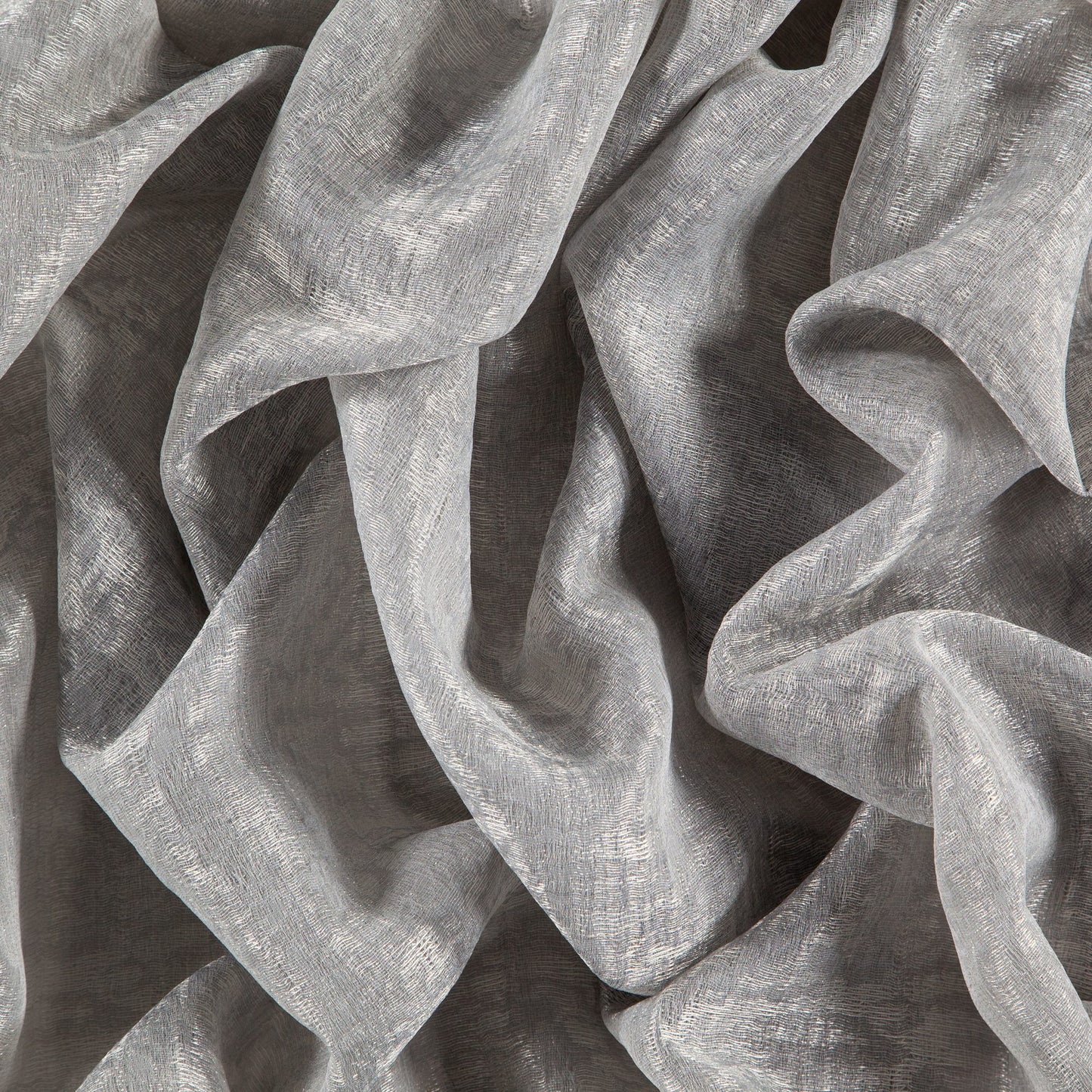 Lightweight metallic silver-gray fabric with crinkled texture and flowing draped folds.