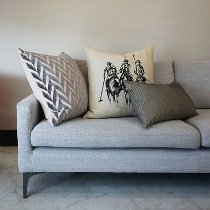 Light gray novelty pillow with polo-players print.