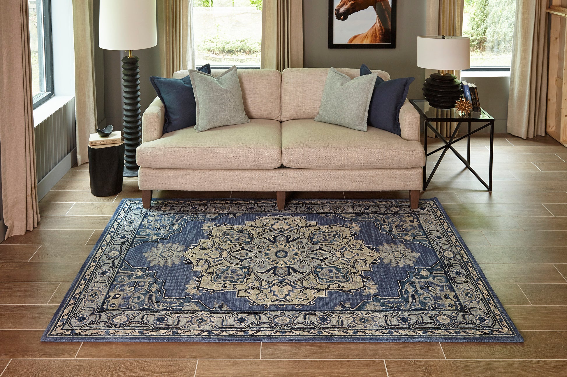 Blue and ivory ornate rug in a modern living room, 5' x 8'.