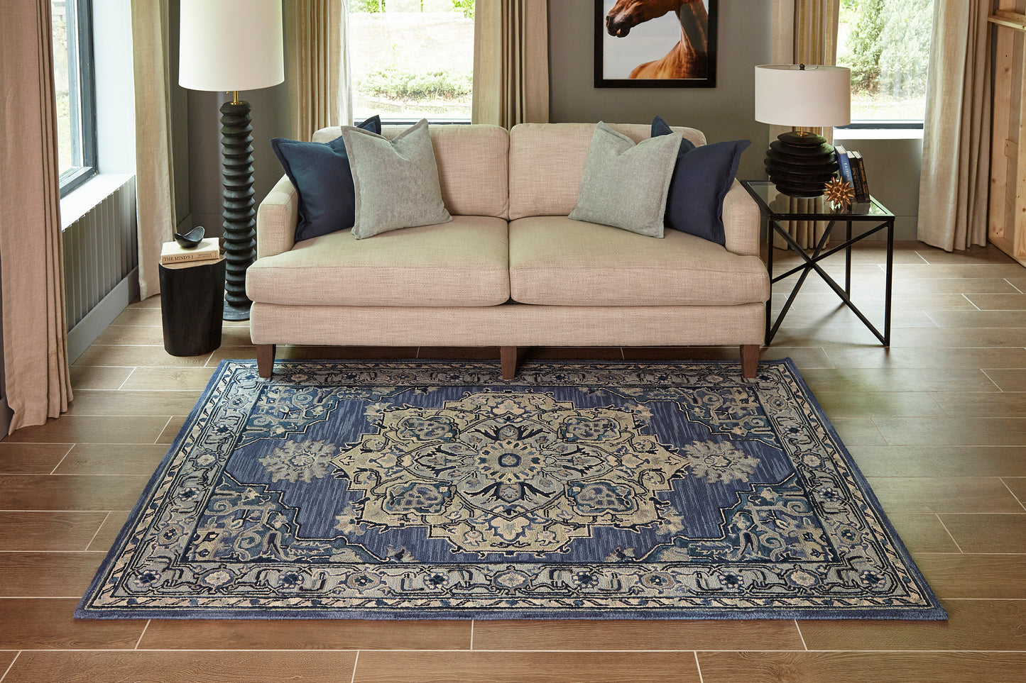 Blue and beige oriental-style rug runner, 2' x 8', on the floor in a modern living room, with a beige sofa and navy and gray cushions nearby.