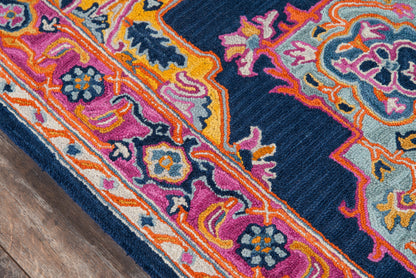 Rectangular runner rug with navy base, floral motifs in pink, orange, yellow & teal, cream border, plush wool pile, 2' x 8'.