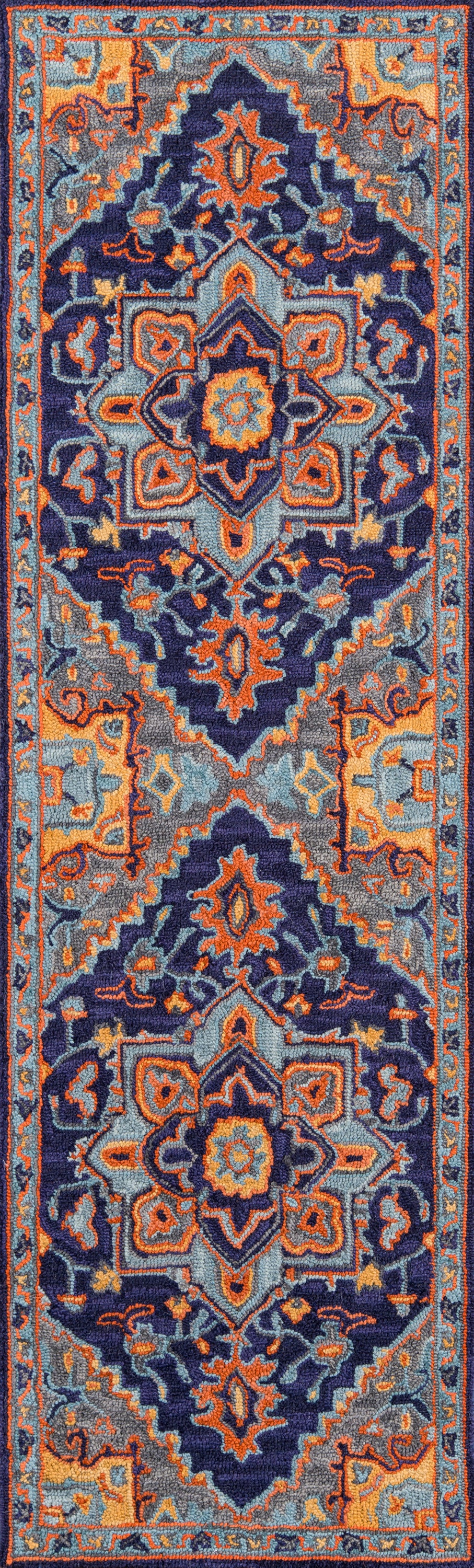 Long Persian-style rug runner in navy, orange, teal and gray with ornate central medallions and borders.