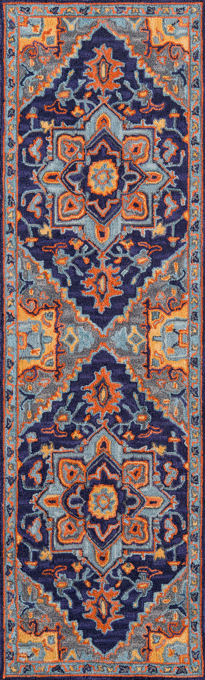 Long Persian-style rug runner in navy, orange, teal and gray with ornate central medallions and borders.