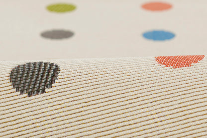 Cream rug featuring multicolor polka dots and stitched black & red hearts; 4' x 6'.
