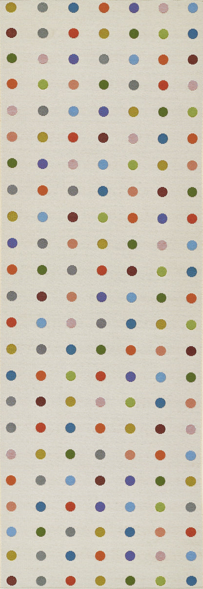 Tall beige woven rug featuring a grid of small multicolor polka dots; playful geometric pattern.