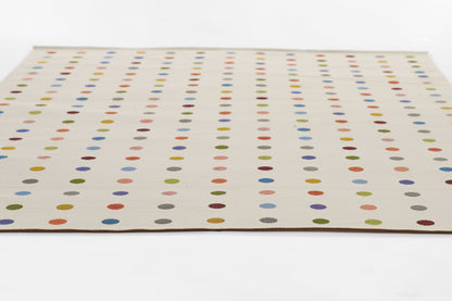 Beige rug featuring evenly spaced multicolor circular dots in vertical columns; modern dotted pattern.