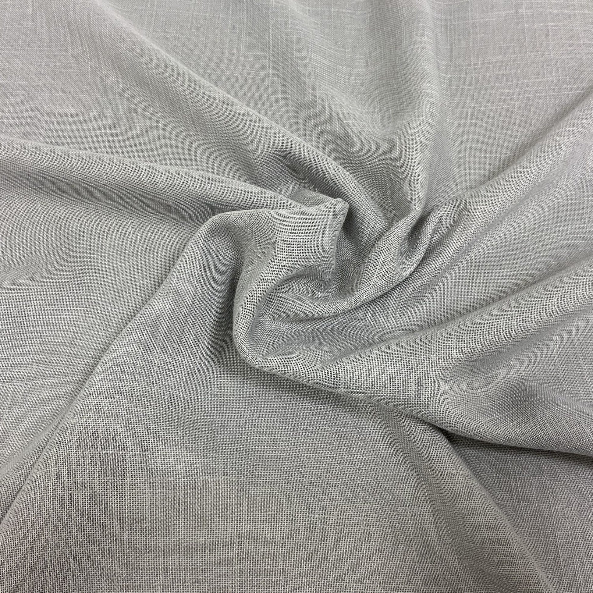 Light gray linen-like fabric with subtle woven texture and soft drape; versatile for apparel or home decor.