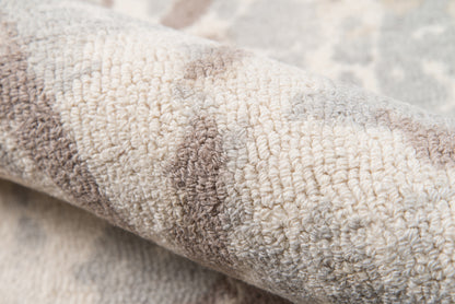 Close-up of a plush beige-gray loop-pile rug runner with ivory and taupe tones, soft textured surface.