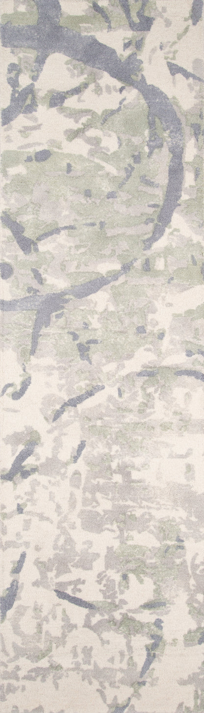 Abstract camo-pattern rug in ivory, pale grey and sage green with a soft, textured weave.