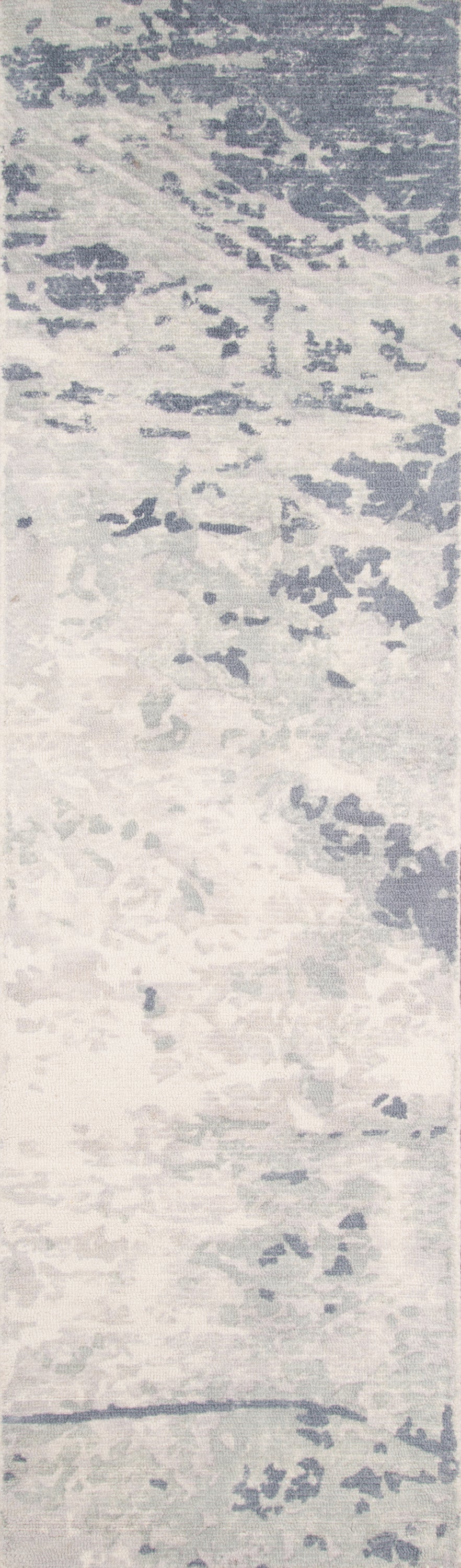 Blue-gray irregular blotches on pale background; modern abstract textile or wallpaper print.