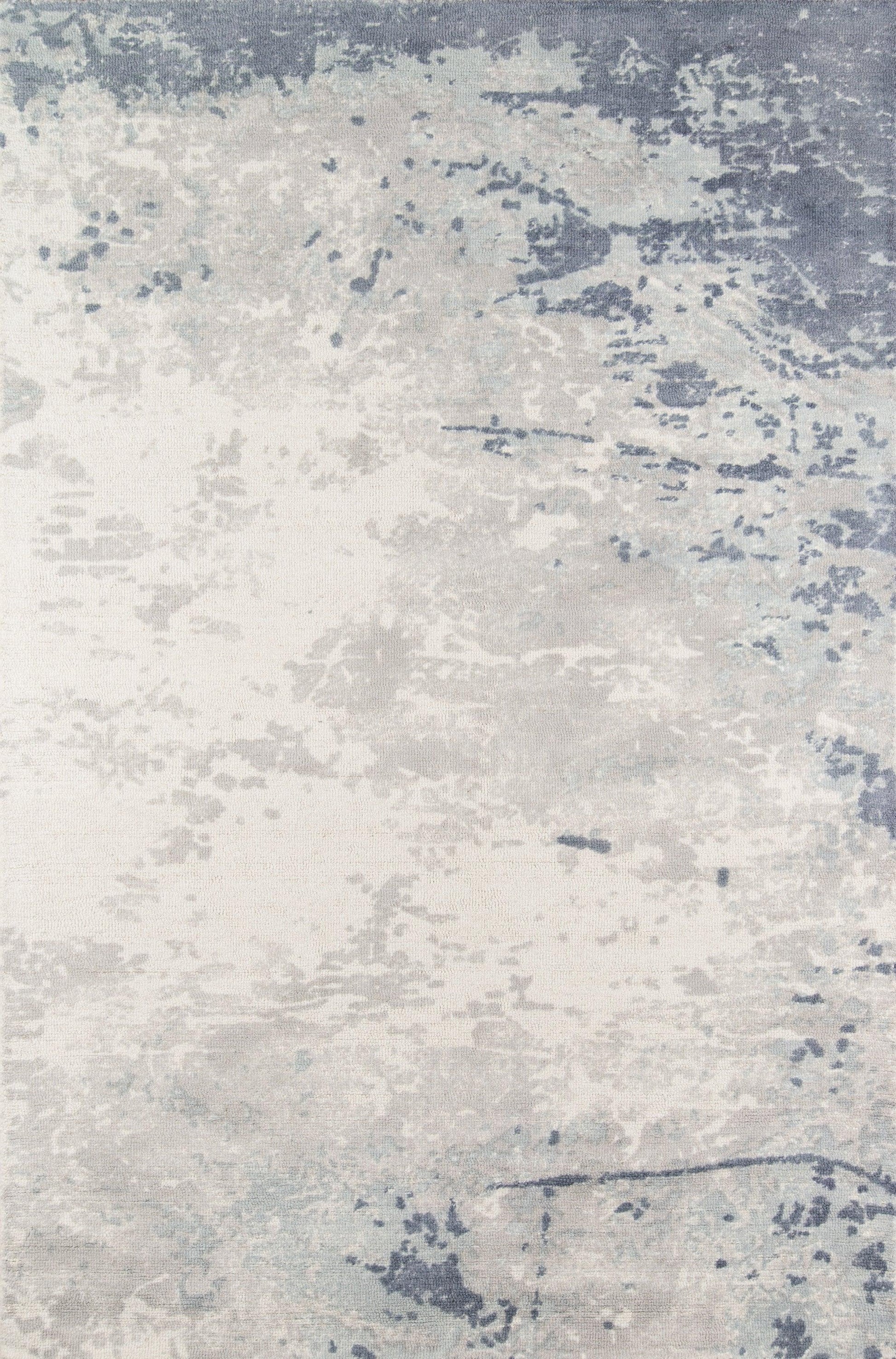 Rectangular area rug in blue-gray and ivory with a distressed abstract pattern; soft pile for modern living room decor.