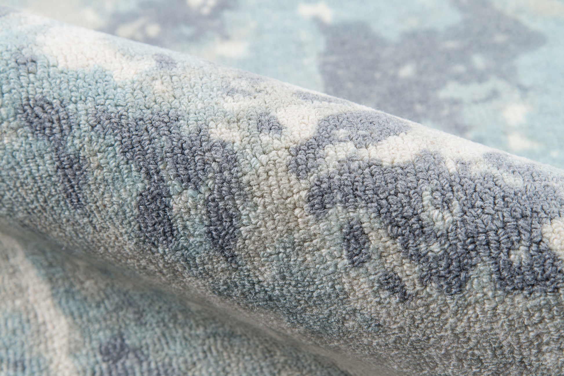 Blue-gray patterned rug with dense tufted pile, ivory accents, modern cozy area rug.