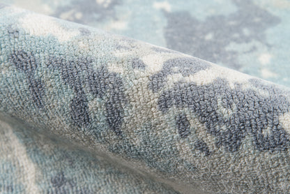 Blue-gray patterned rug with dense tufted pile, ivory accents, modern cozy area rug.