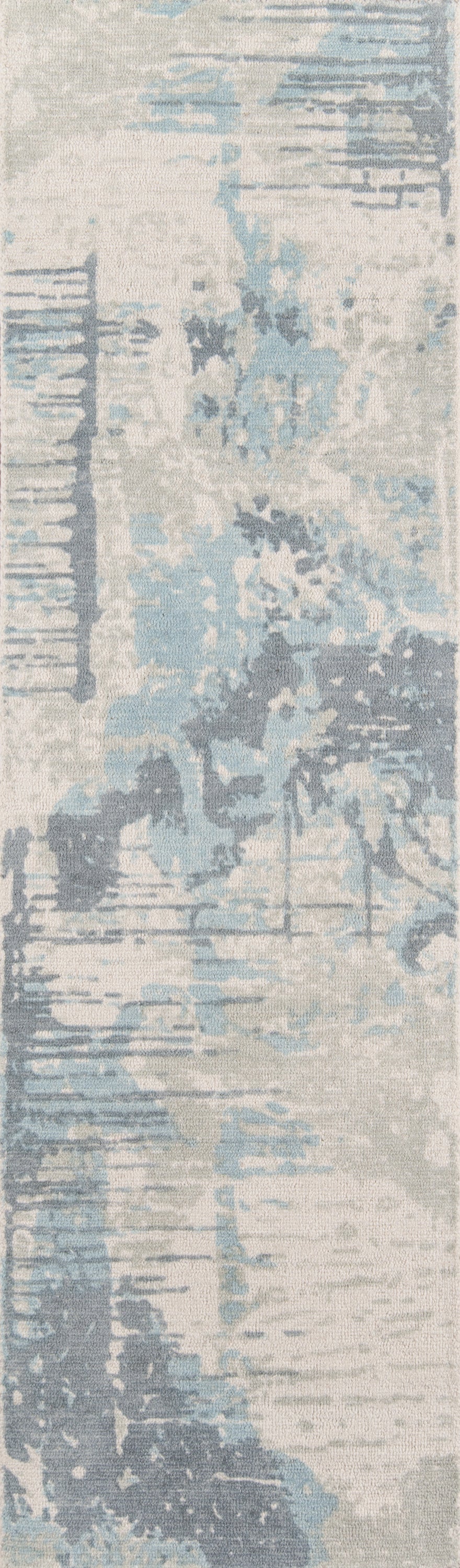 Rectangular abstract area rug in pale blue, ivory and gray with watercolor-style pattern and soft textured pile.
