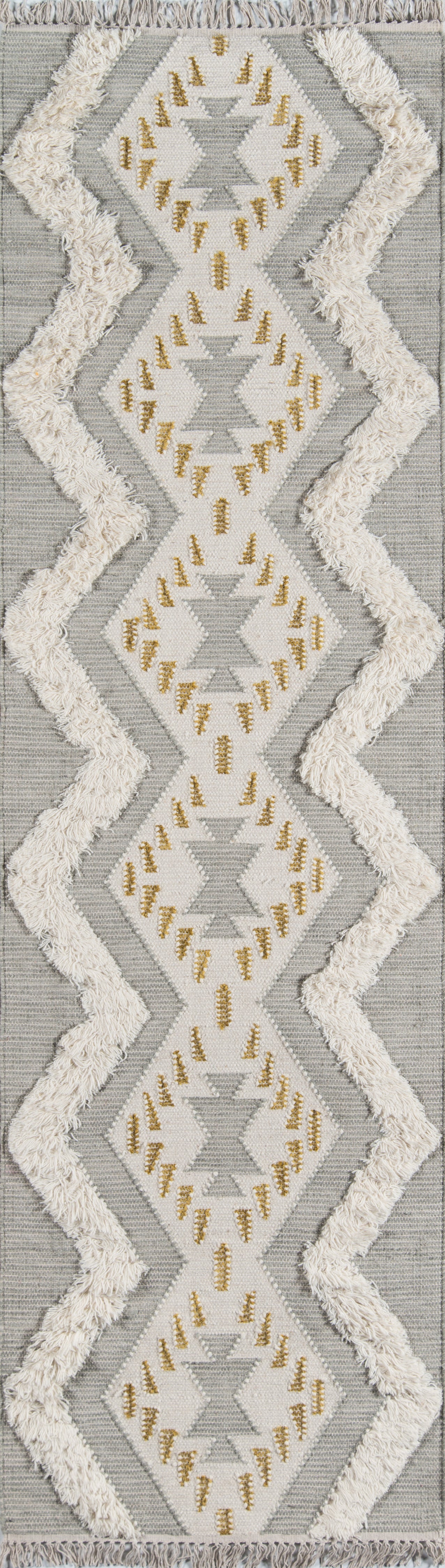 Gray geometric rug with white diamond panels, gold embroidery and cream shaggy fringe.