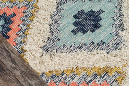Geometric kilim rug with turquoise field and navy diamond motif, coral & mustard zigzag border, beige fringe on wood floor (3' x 5')