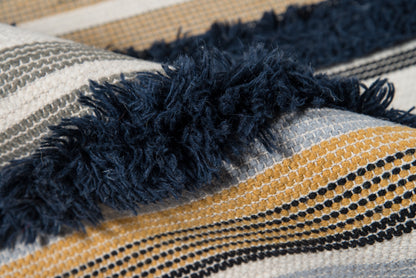 Navy fringe detail on a striped woven rug, 2' x 3'.