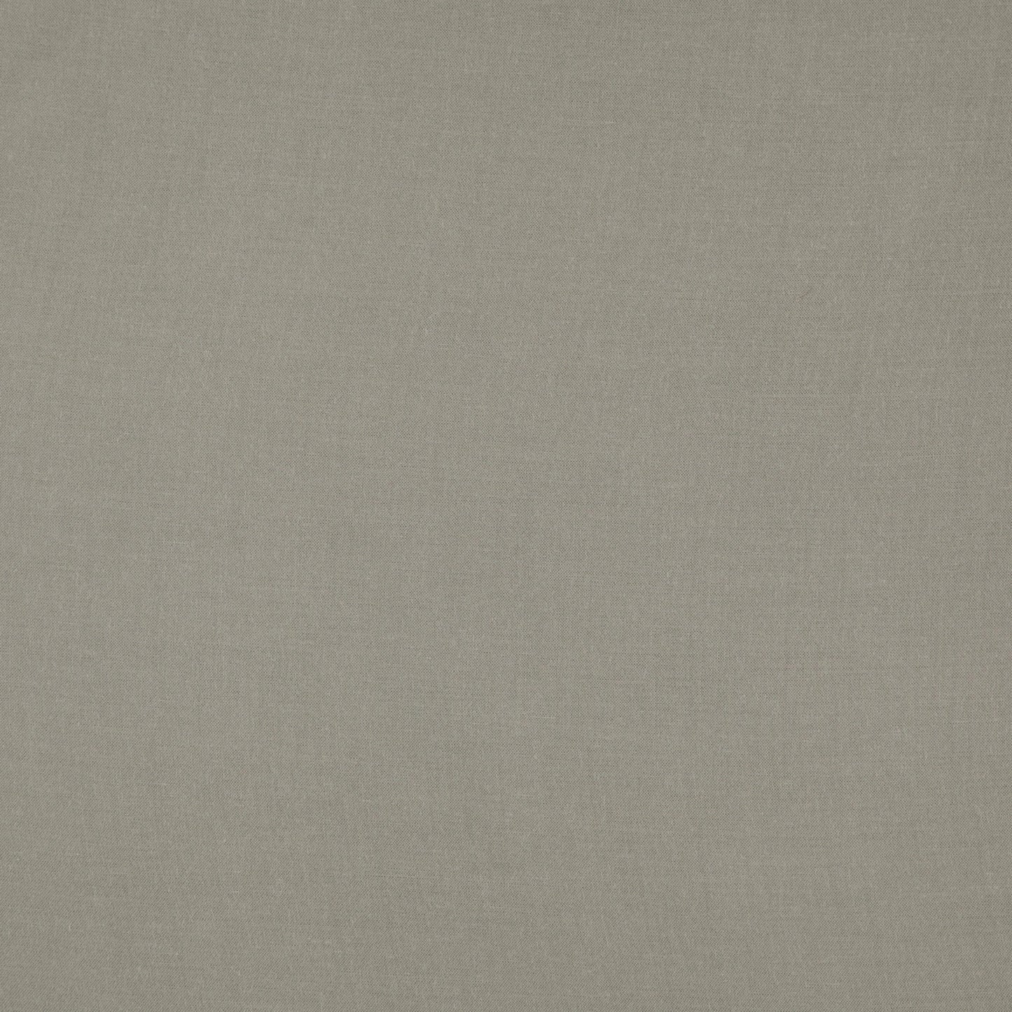 Green linen-textured fabric with a subtle weave; neutral upholstery background.