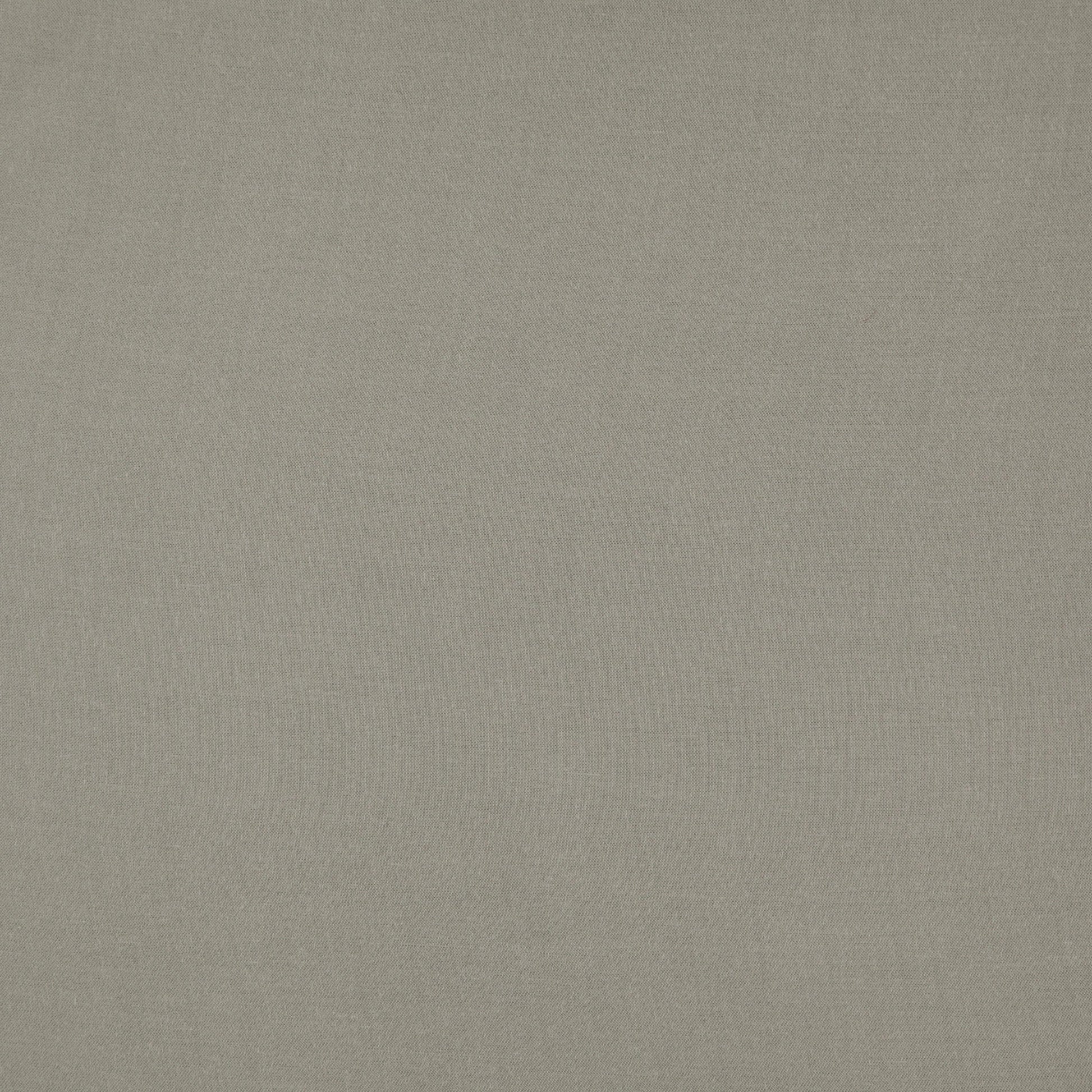 Green linen-textured fabric with a subtle weave; neutral upholstery background.