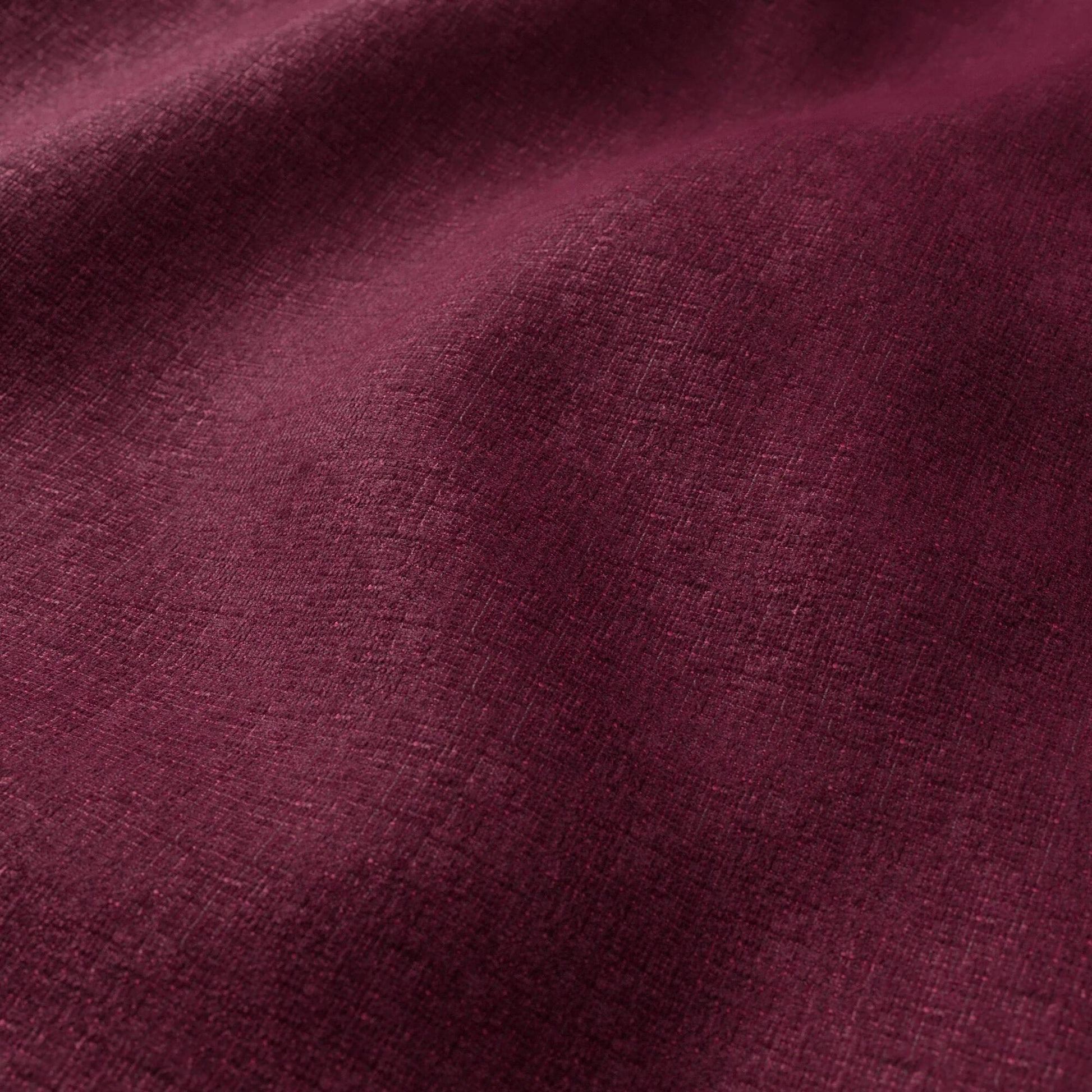 Close-up of mauve-purple chenille fabric with soft pile.