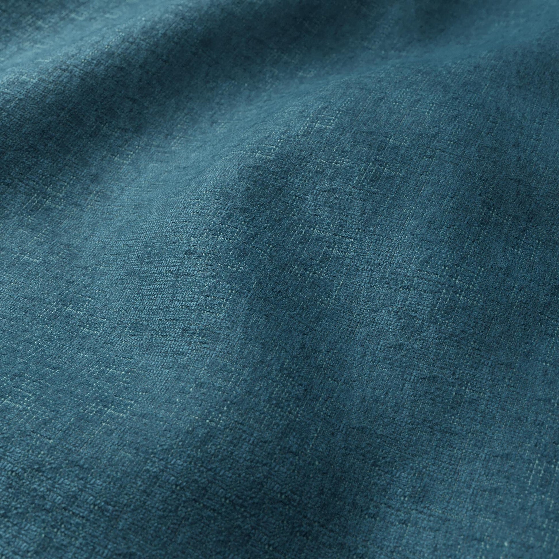 Teal chenille fabric close-up with plush pile texture and soft folds.