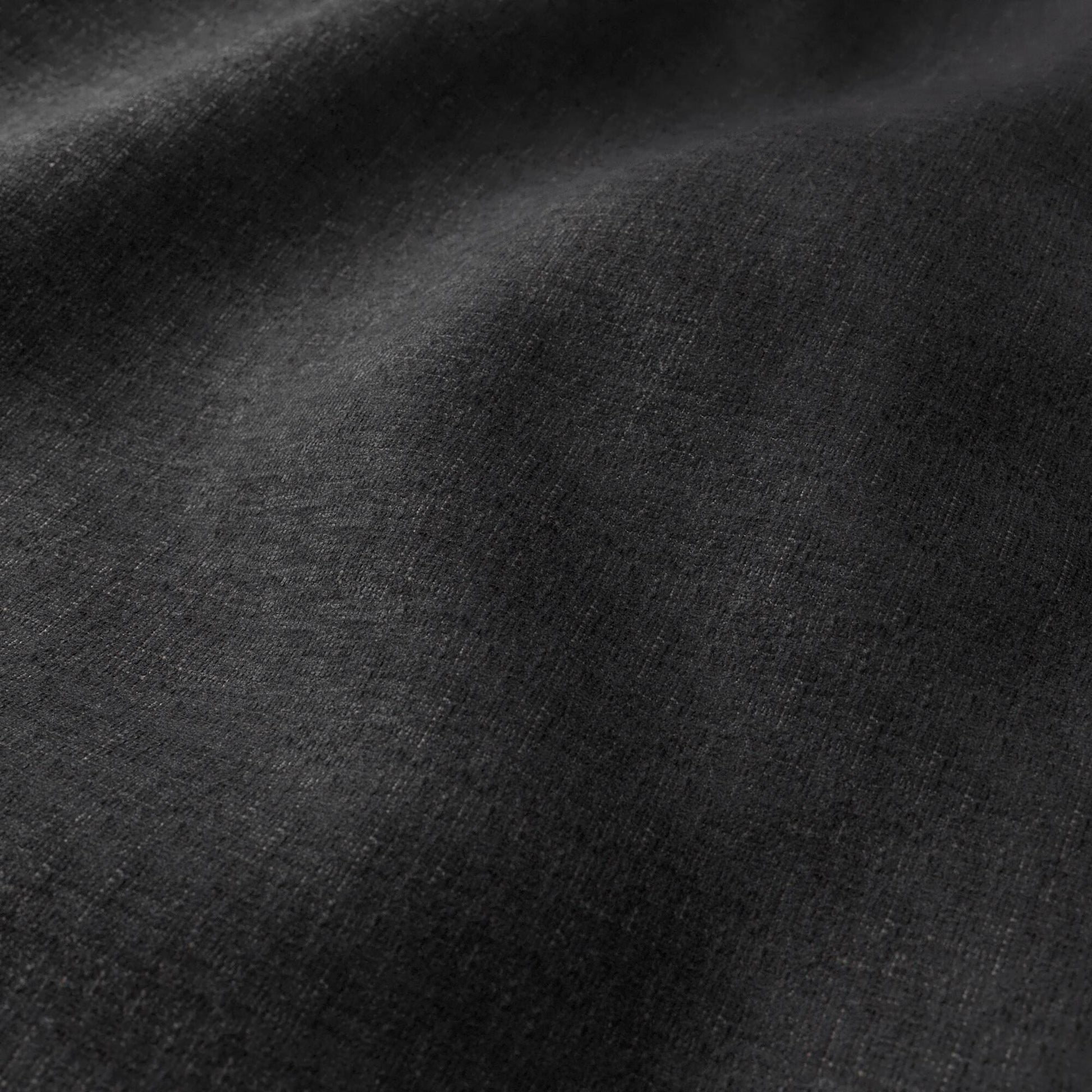 Charcoal black woven fabric with subtle texture and soft drape, ideal for garments.