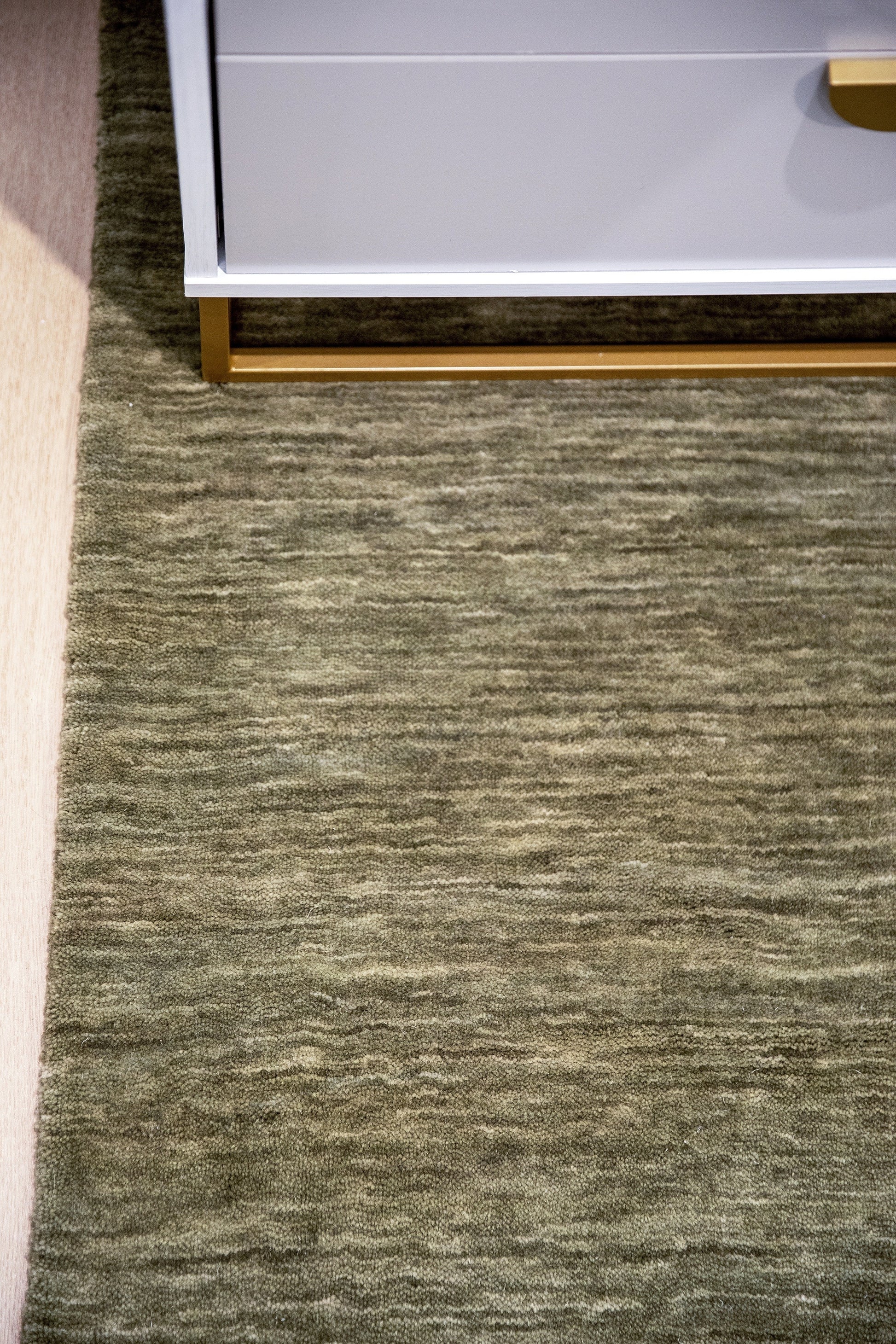 Gray-green textured rug, 5' x 8'.
