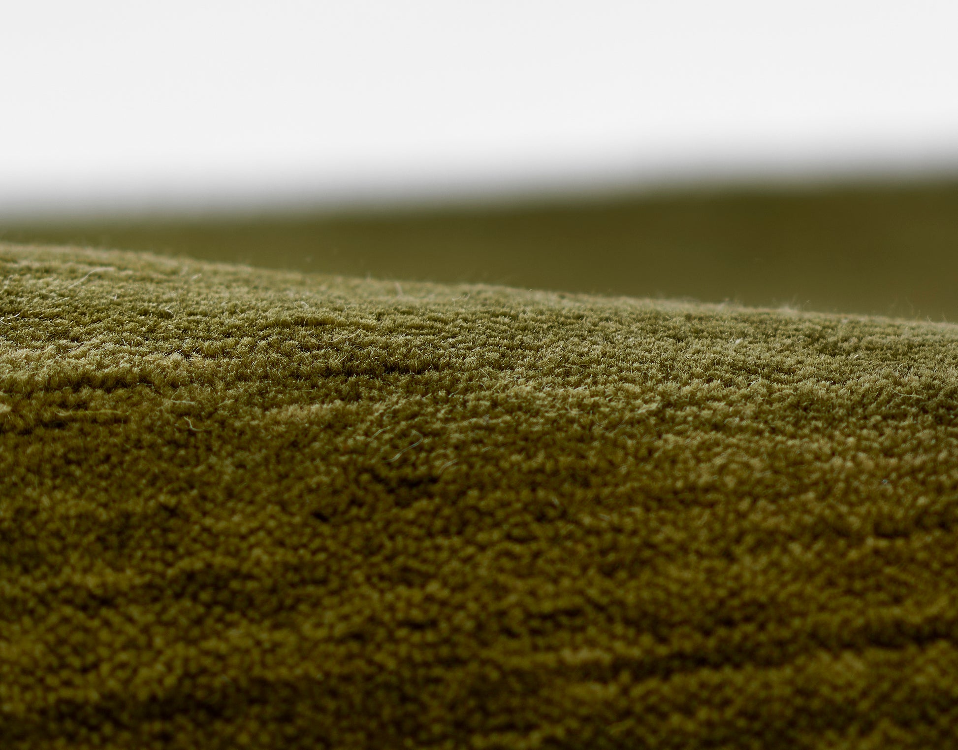 Olive-green rug runner, 2' x 8'.
