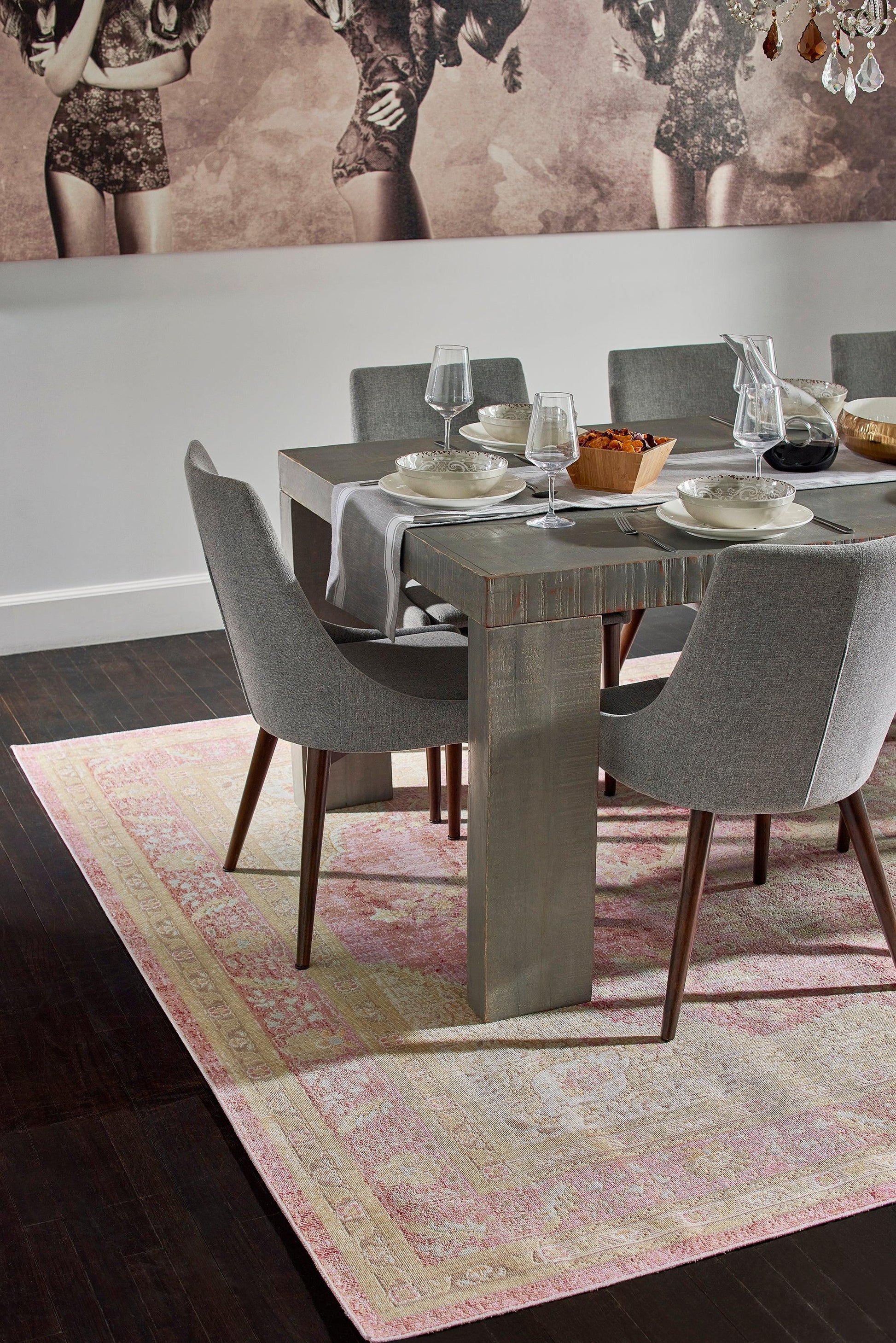 Pink-toned area rug with a subtle pattern, size 9' x 12', shown in a room.