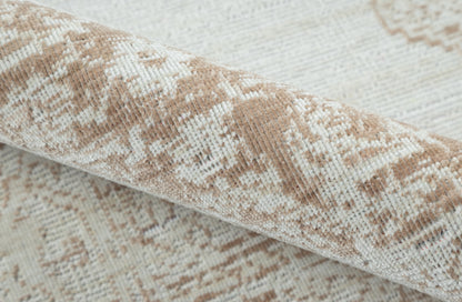 Beige and brown woven area rug with subtle geometric pattern, rolled edge.