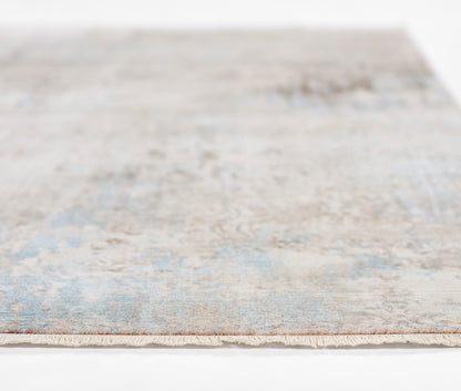Blue and beige distressed rectangular area rug with a soft, low-pile texture; modern vintage style for living spaces.