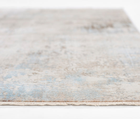 Blue and beige distressed rectangular area rug with a soft, low-pile texture; modern vintage style for living spaces.