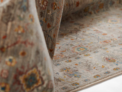 Gray oriental-style area rug with muted multicolor floral motifs and soft pile for living room decor.