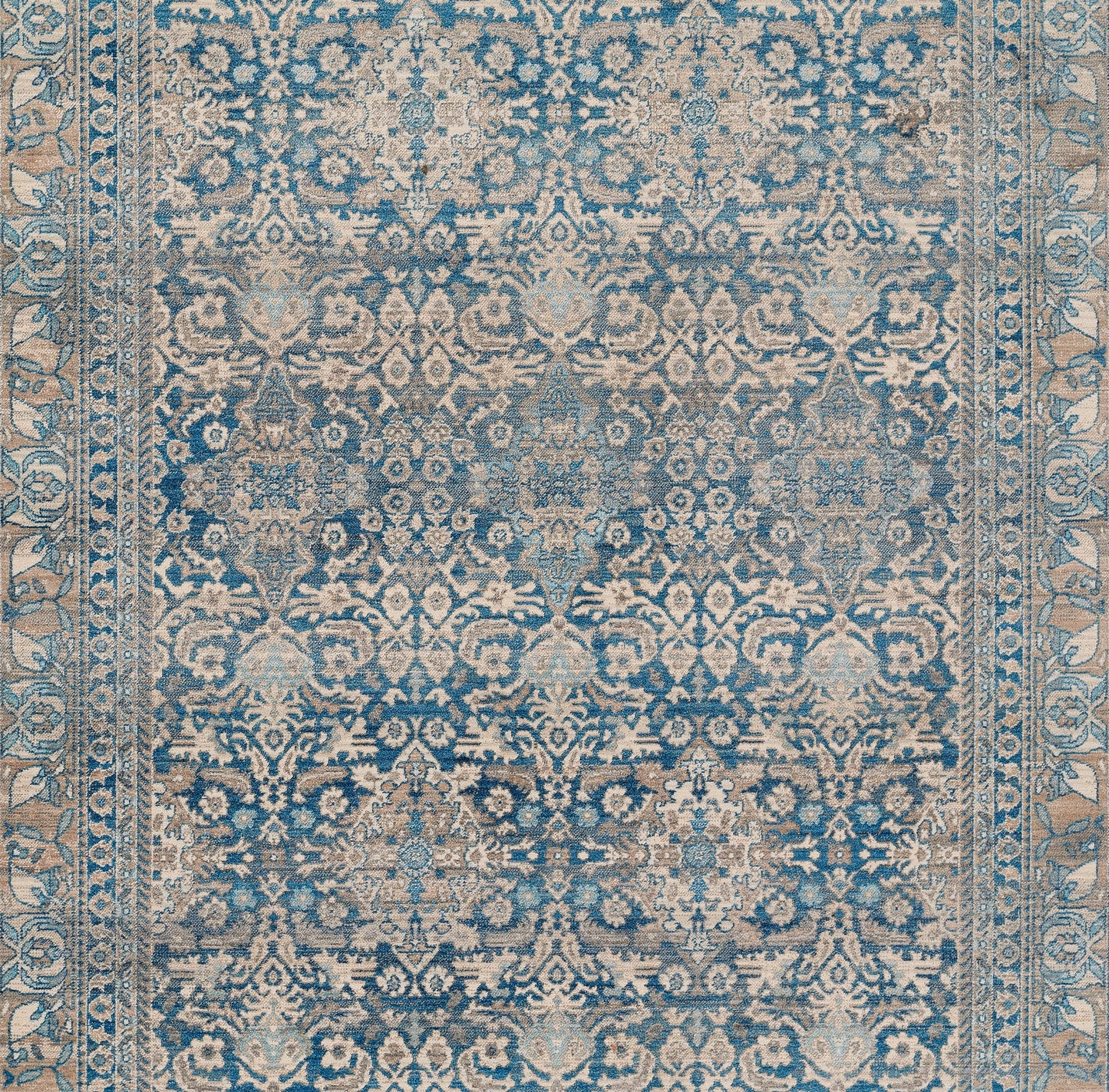 Blue and beige Turkish-inspired ornate rug with distressed floral motifs and decorative border, 2' x 3'.